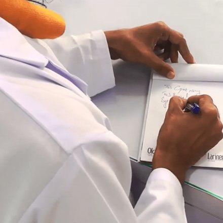 Doctor writing private notes at a desk